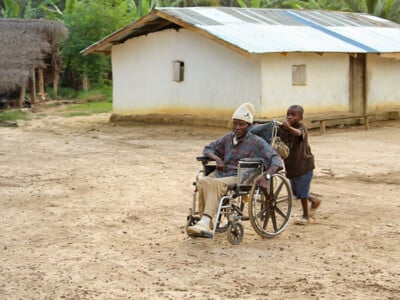 David from Liberia is grateful for food from CAM. grandpa and grandma, Christian Aid Ministries